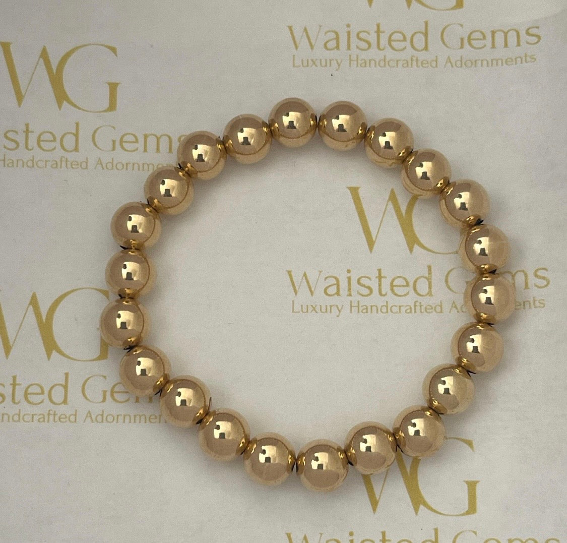 18k Solid Gold 8mm Bead Bracelet on wrist
