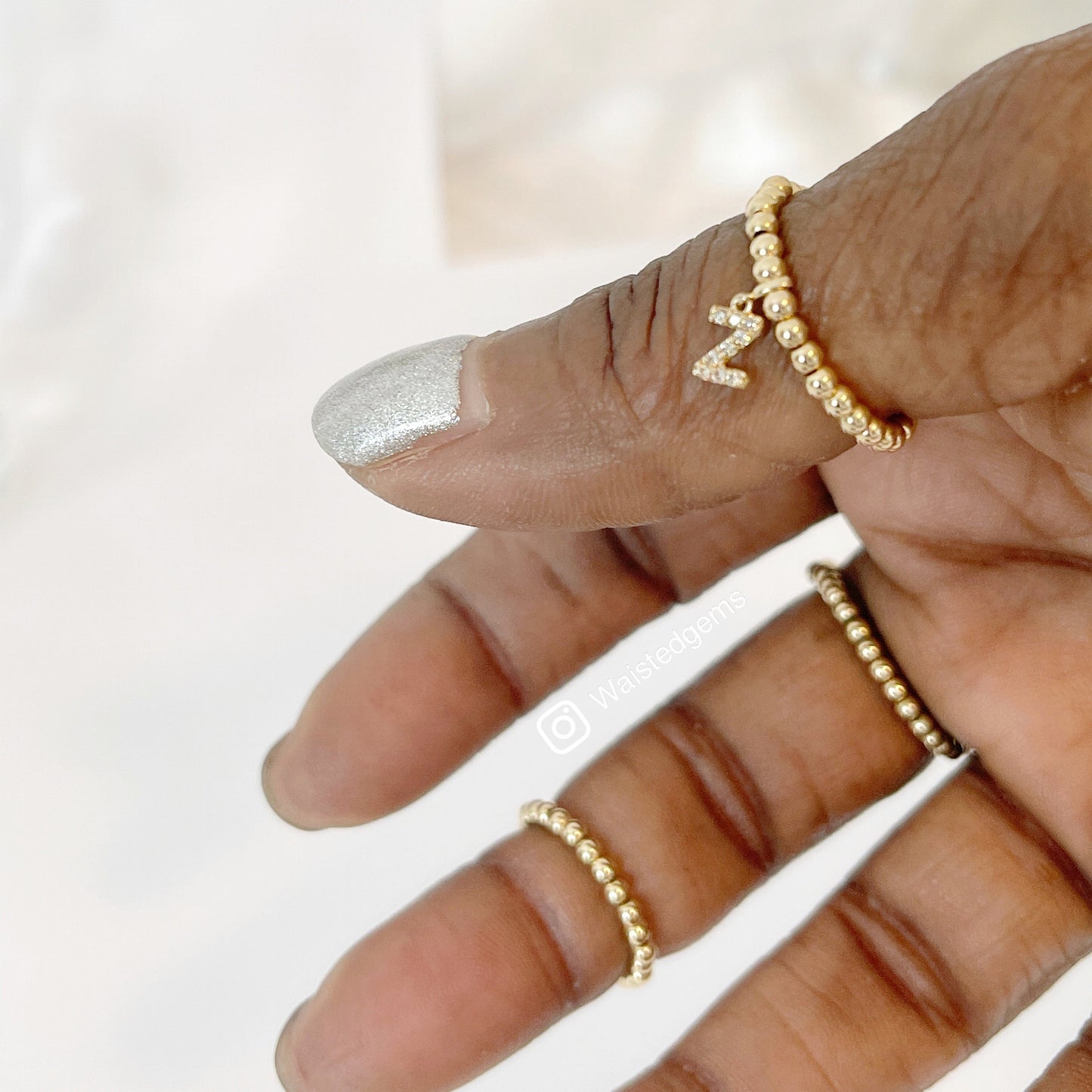 14k Solid Gold Diamond Initial Charm Ring stacked on hand